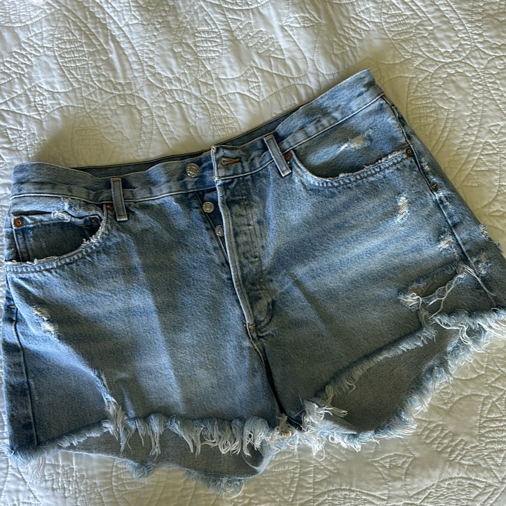 Agolde light wash denim shorts. Distressed. Size 31. Like new.